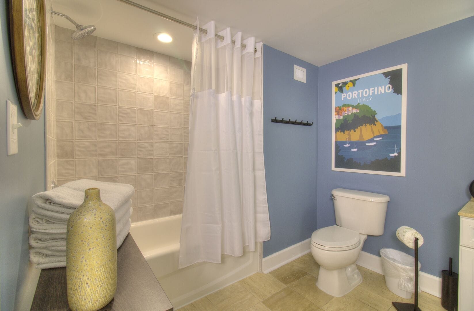 Bathroom with Portofino poster decor.