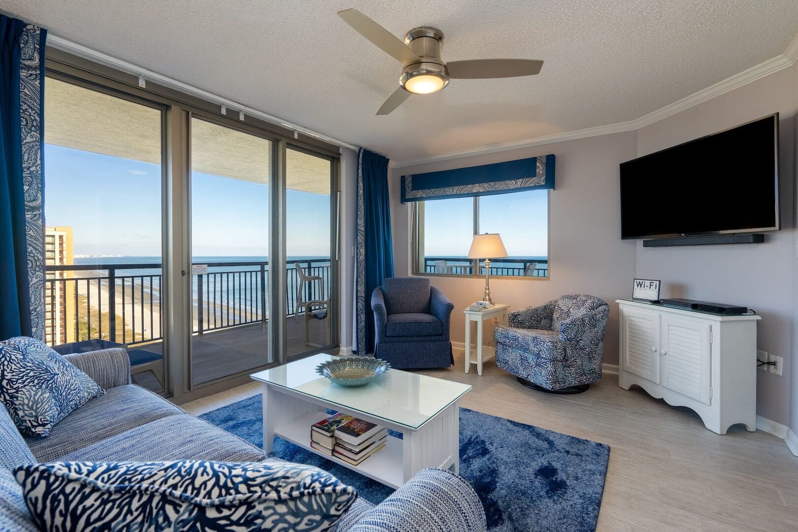 Coastal-themed living room with view.