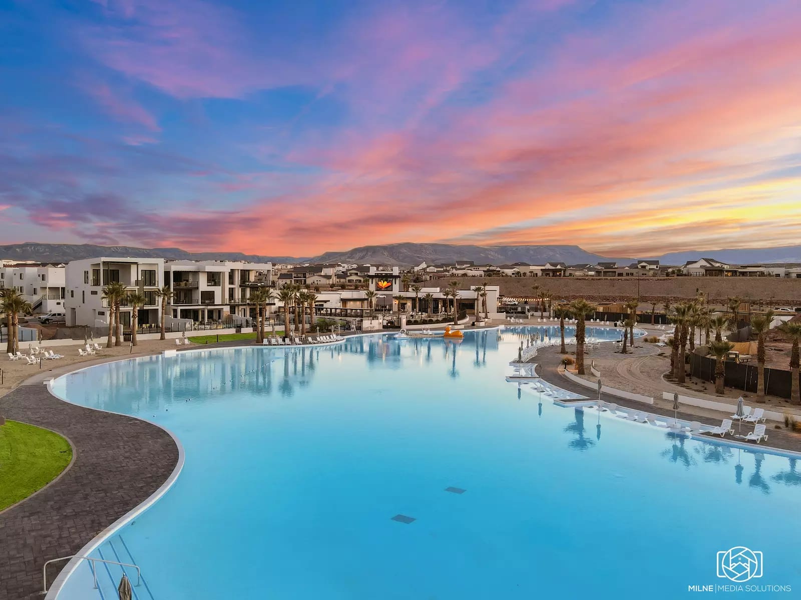 Poolside resort at sunset.