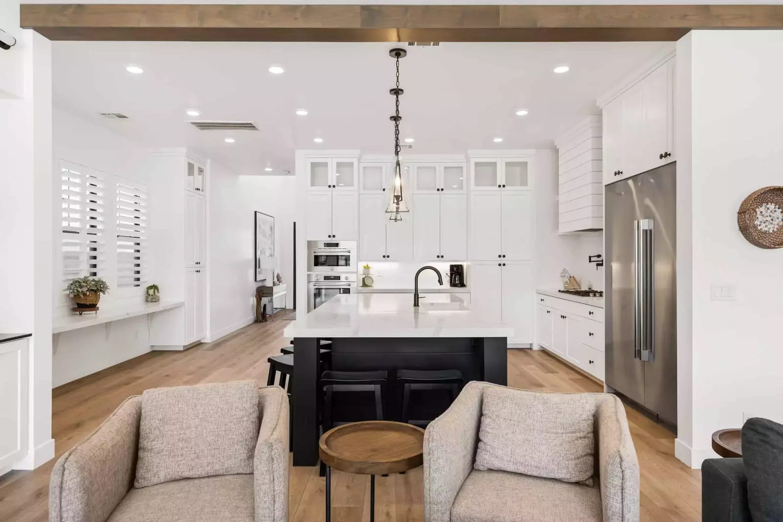 Modern kitchen with white cabinets.