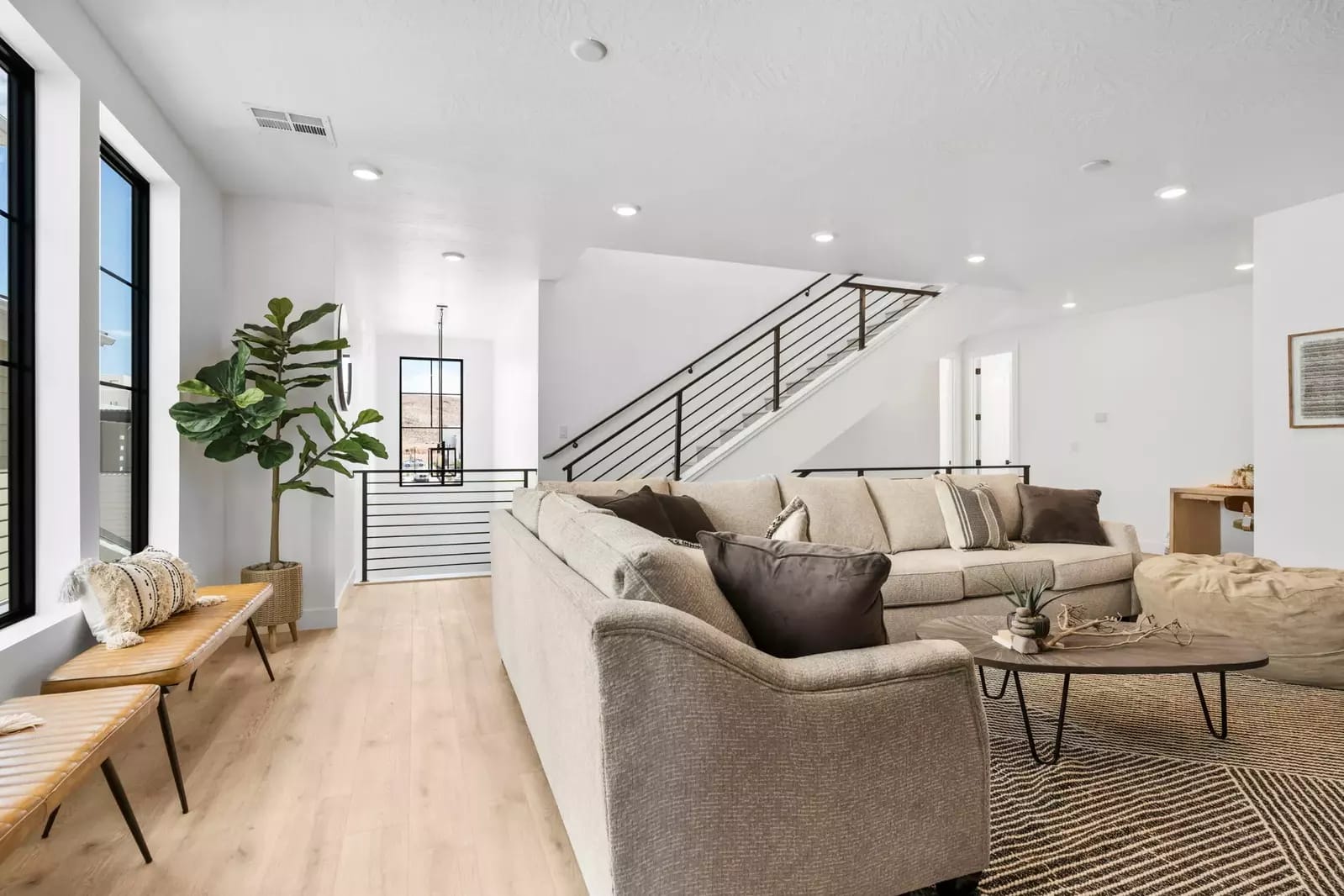 Modern living room with beige sofas.