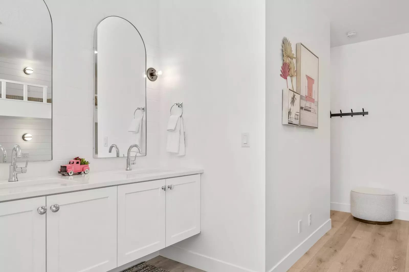 Minimalist bathroom with dual sinks.