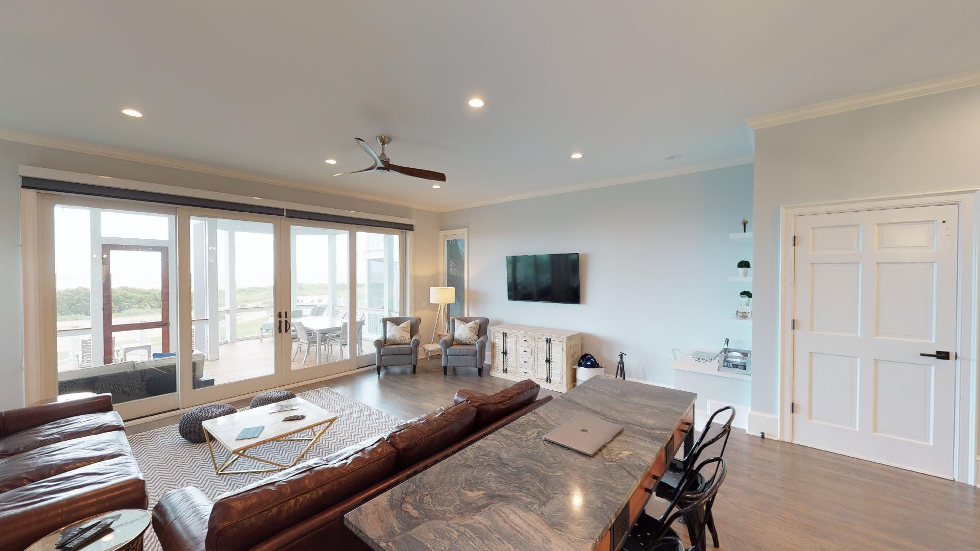 Modern living room with large windows.