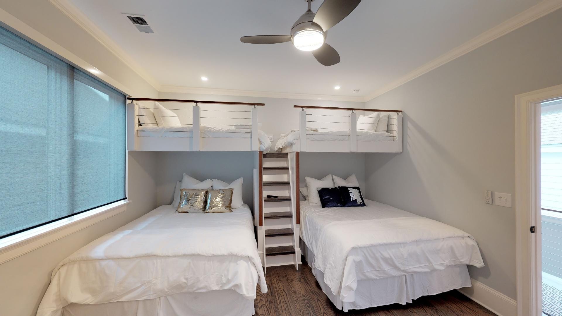 Bedroom with bunk beds and ladder.