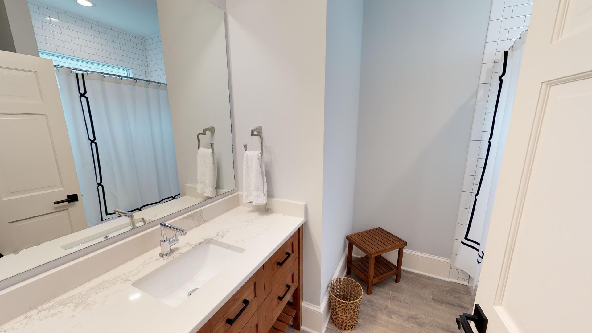 Modern bathroom with shower curtain.