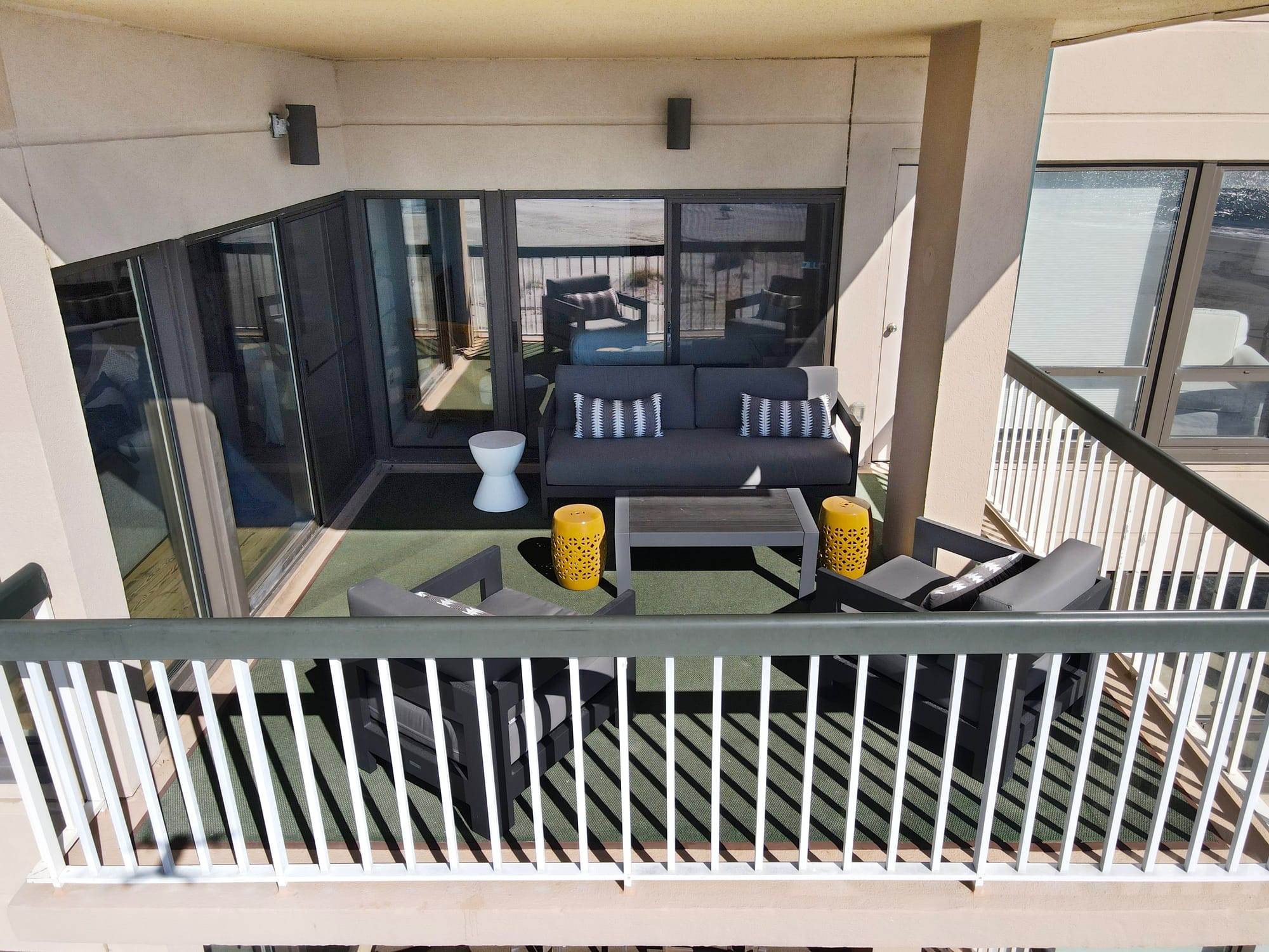 Outdoor balcony with modern furniture.