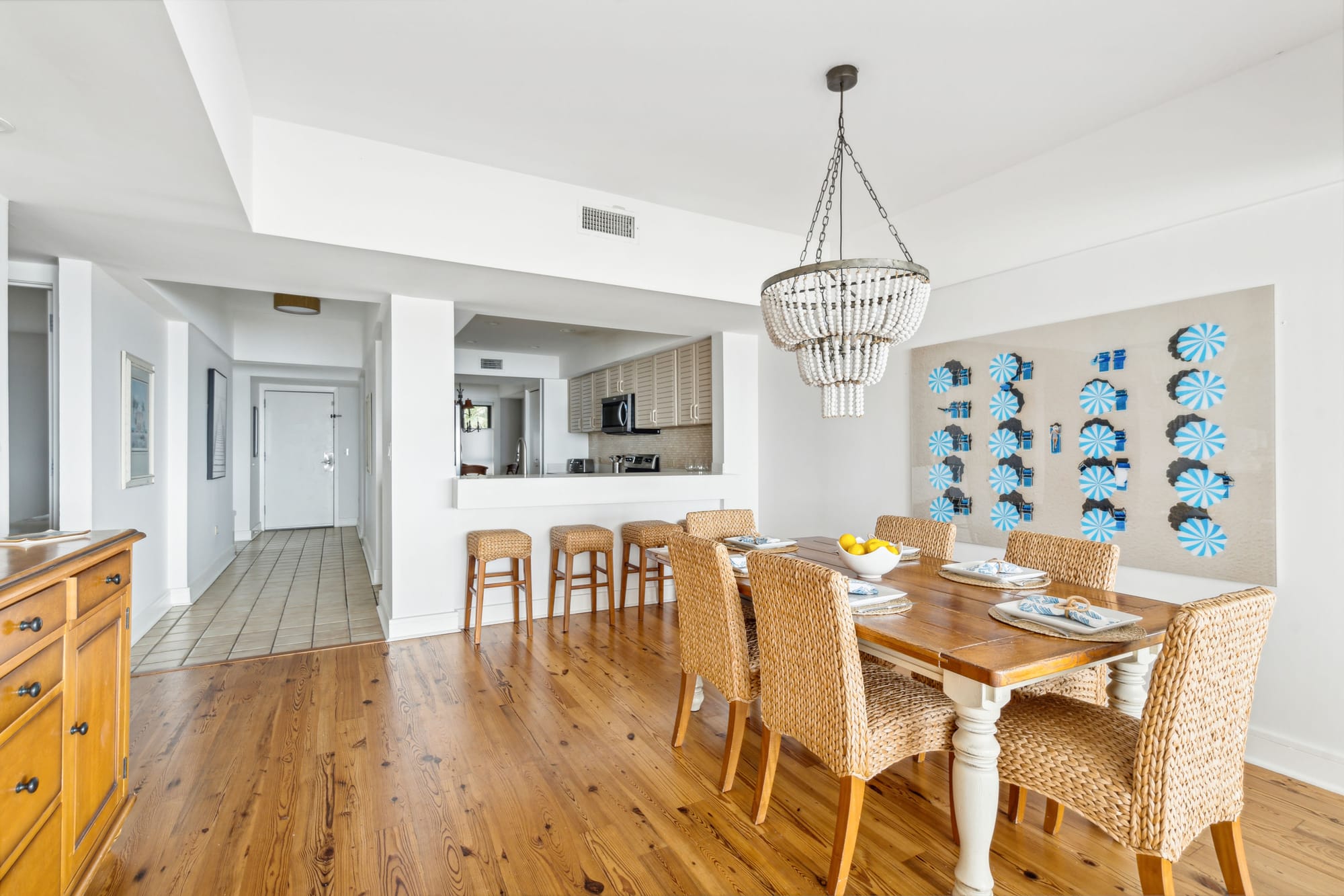 Modern dining room with wicker chairs.