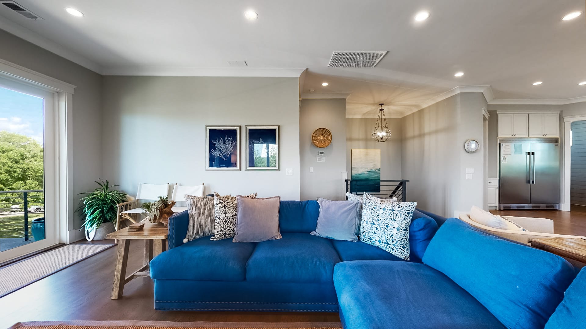 Modern living room with blue sofa.