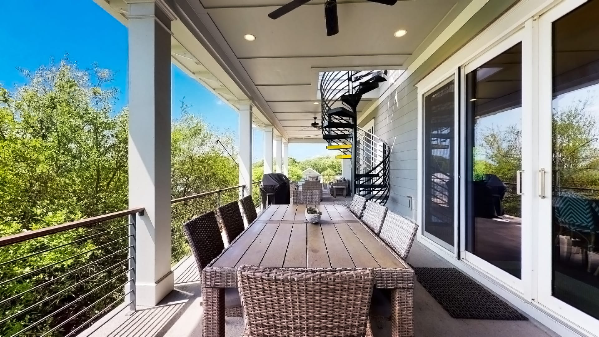 Outdoor patio with spiral staircase.