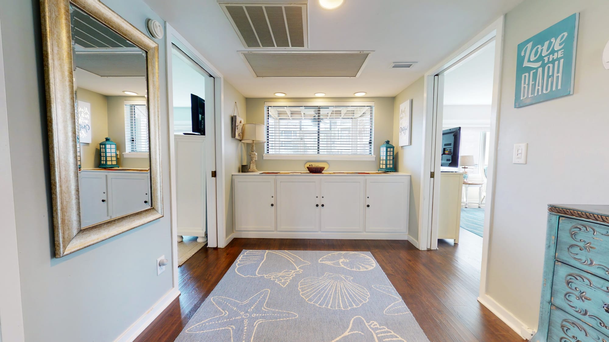 Beach-themed hallway with decorative elements.