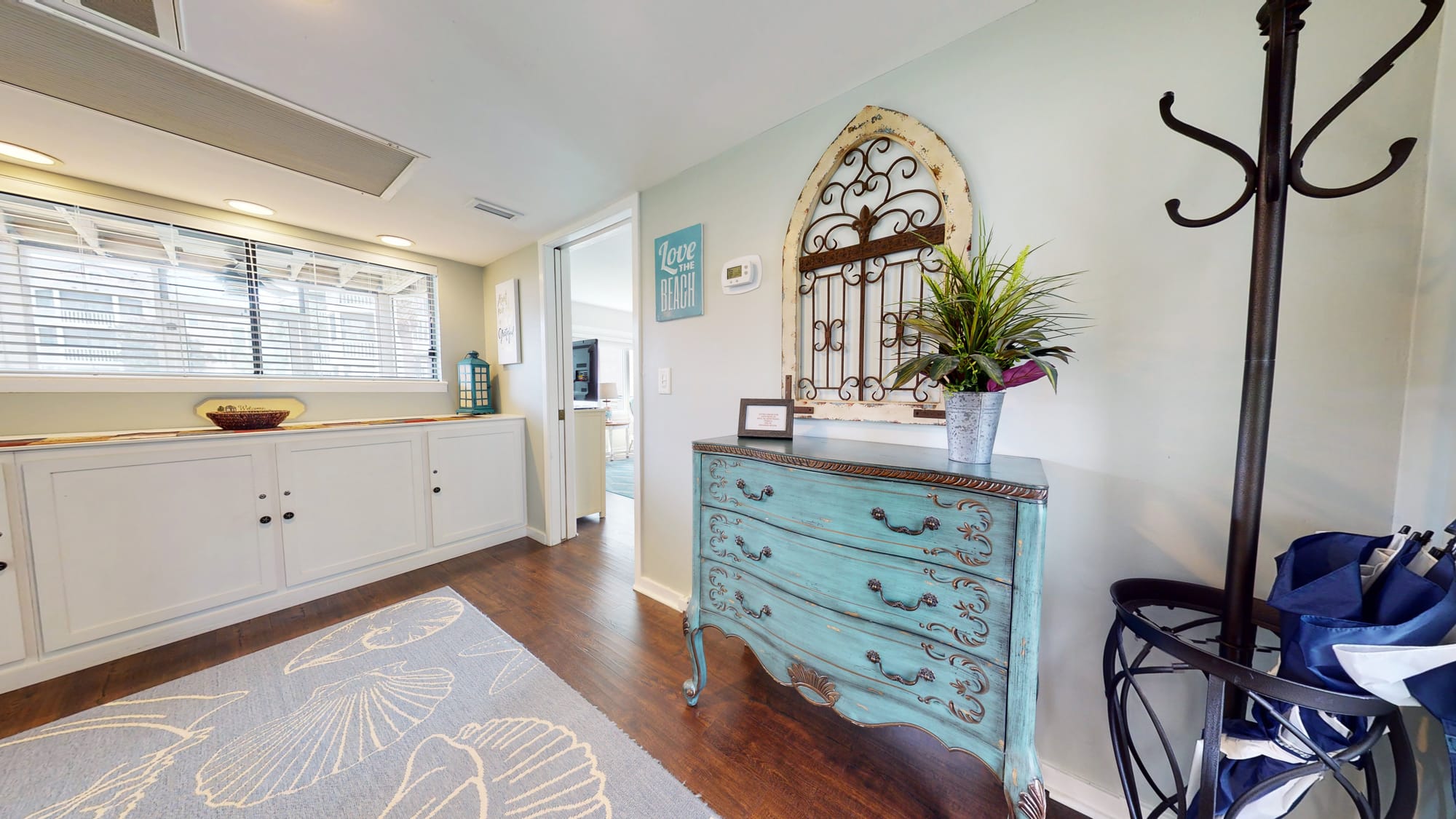 Coastal-themed hallway with decor.