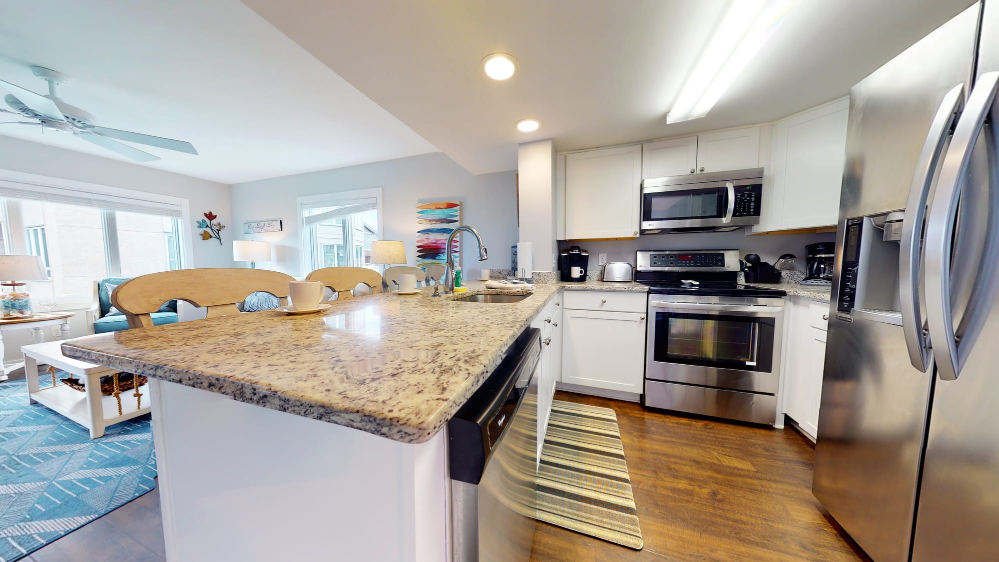 Modern kitchen with stainless appliances.