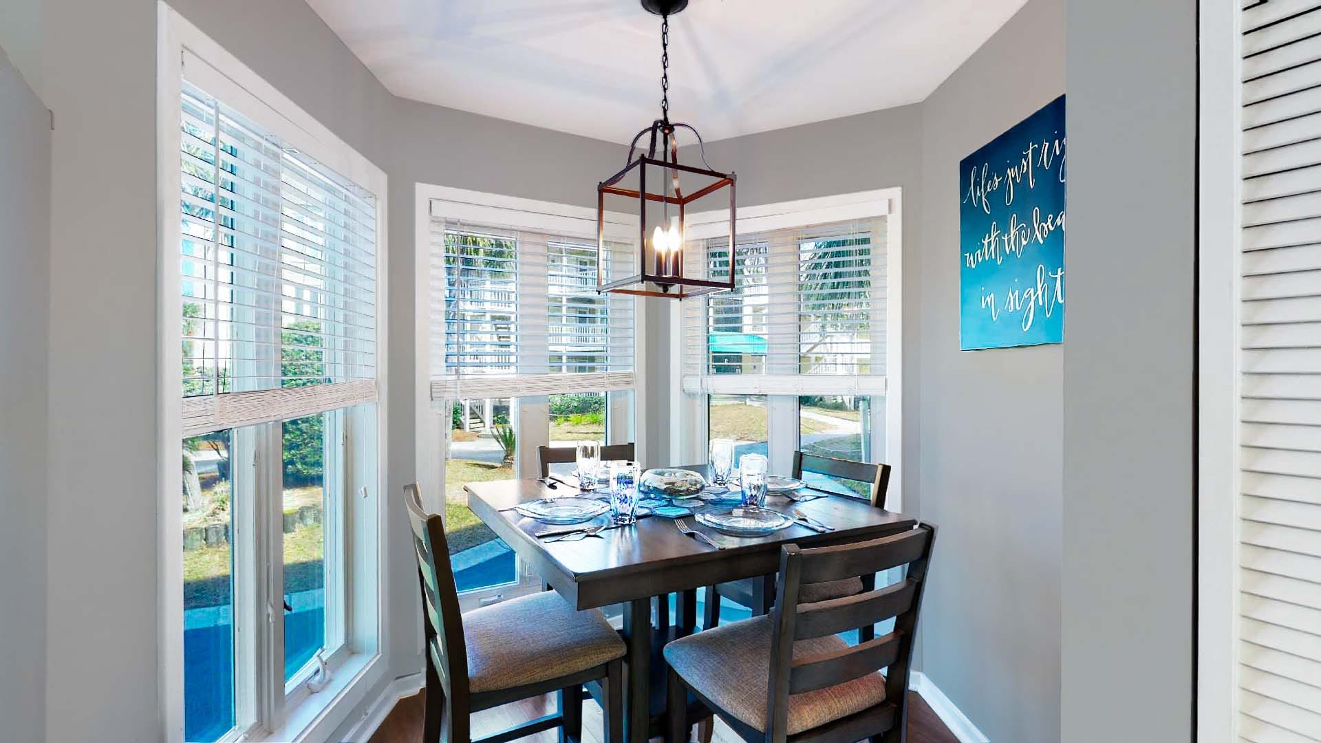 Cozy dining area with windows.