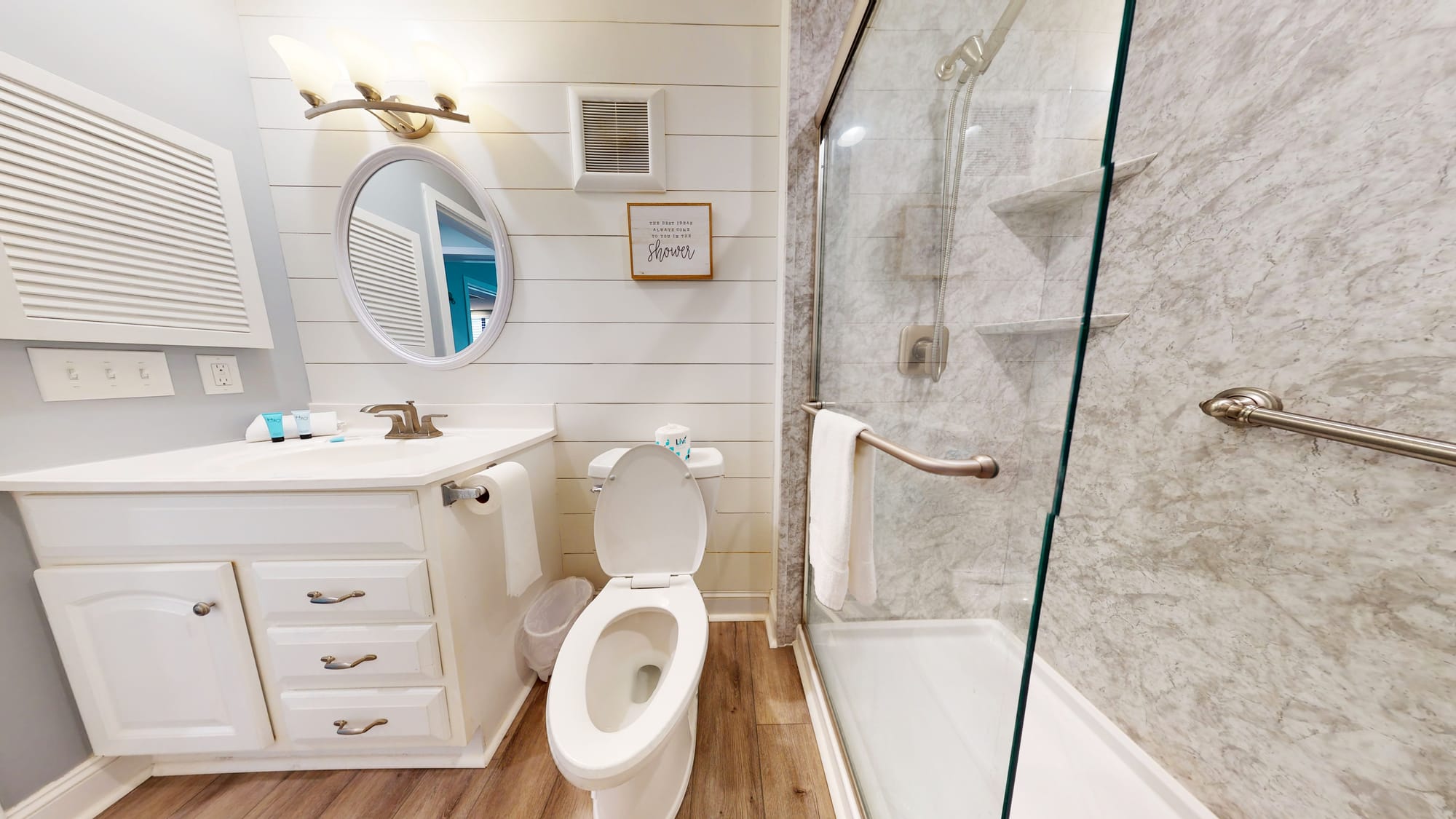 Modern bathroom with glass shower door.