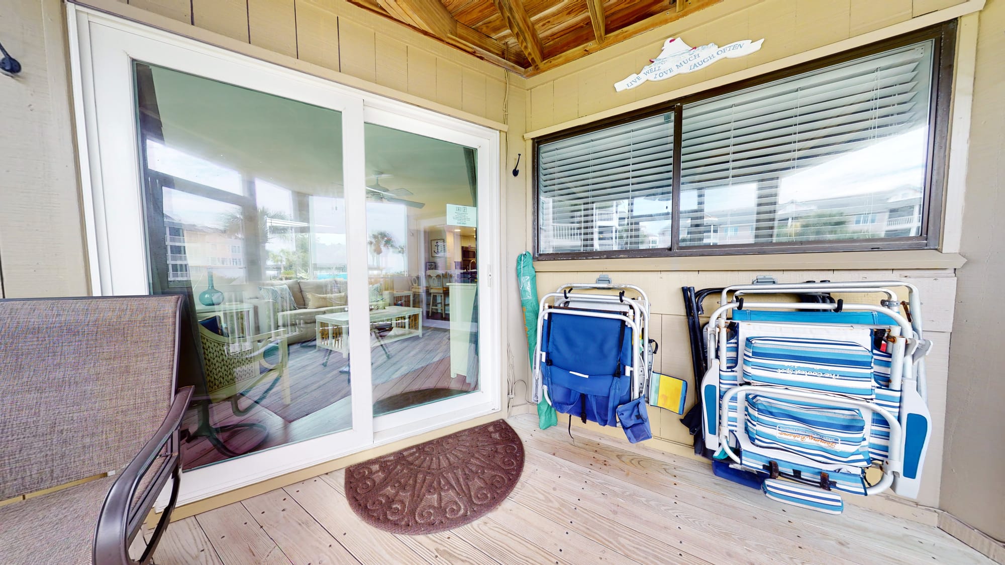 Patio with chairs and sliding door.