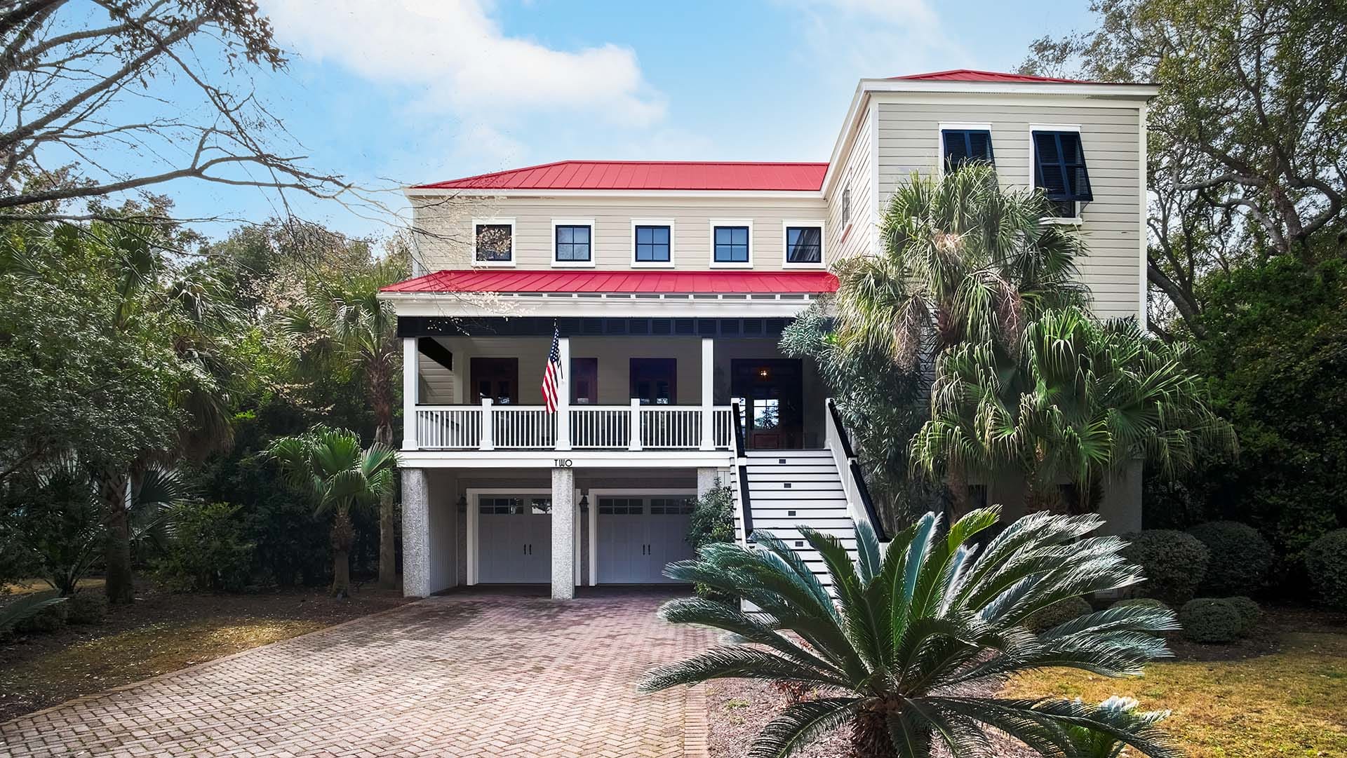 Two-story house with red roof.