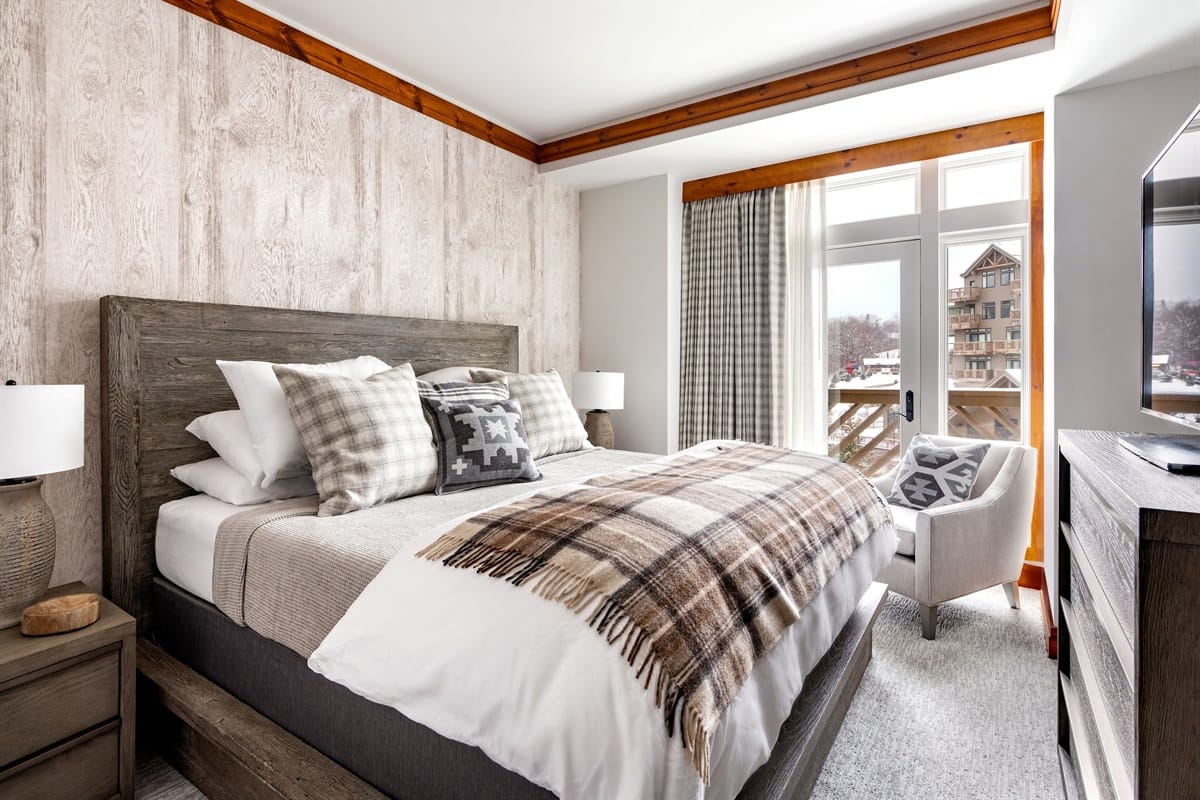 Cozy bedroom with plaid decor.