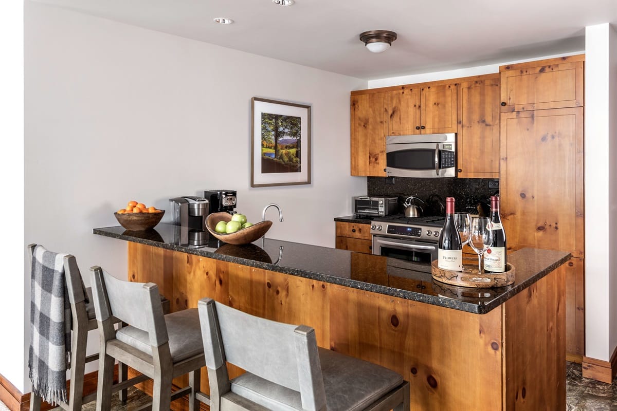 Modern kitchen with bar stools.