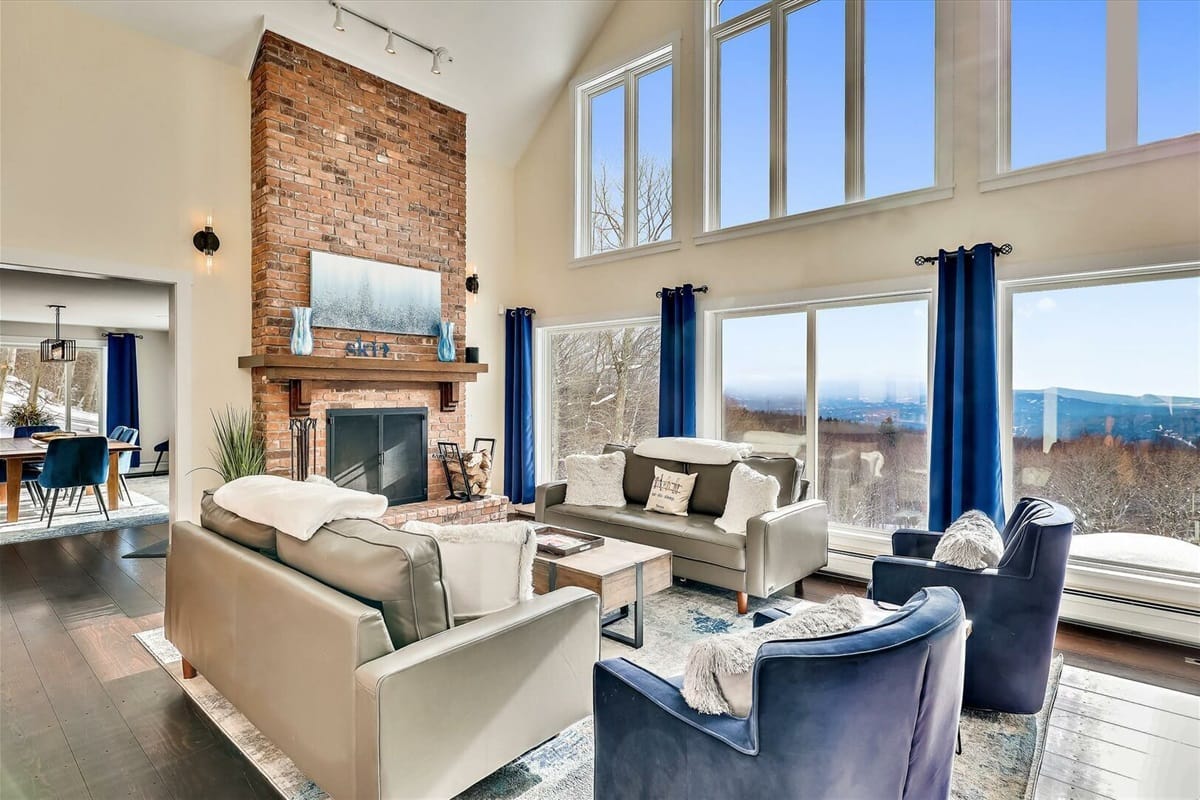 Modern living room with large windows.