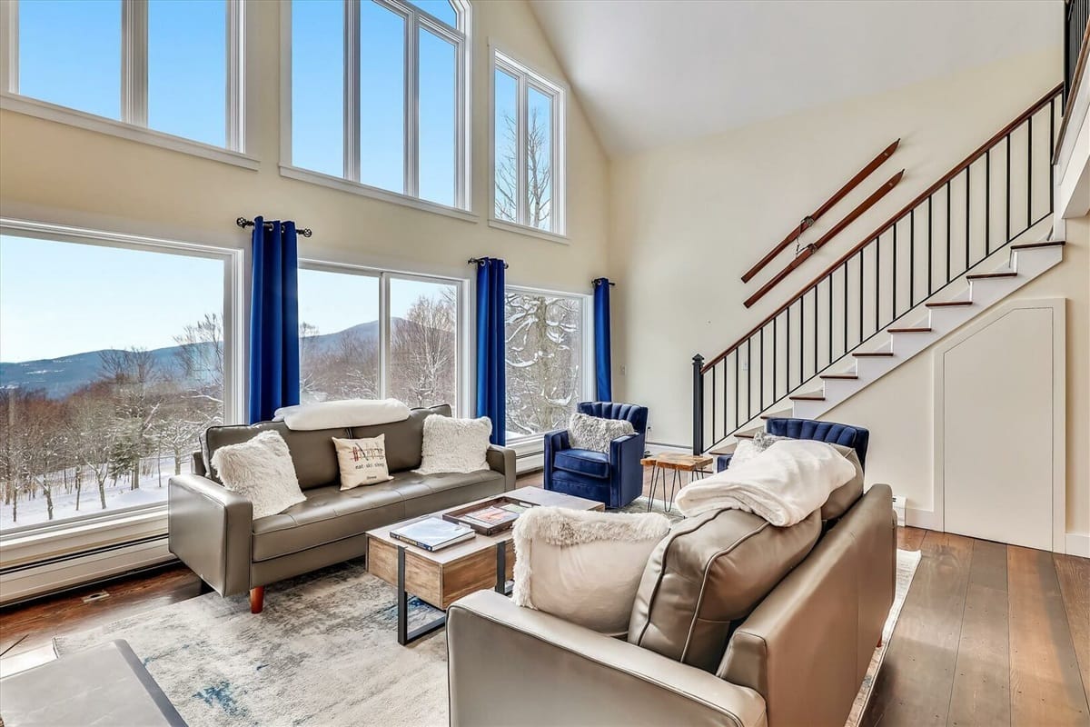 Spacious living room with large windows.