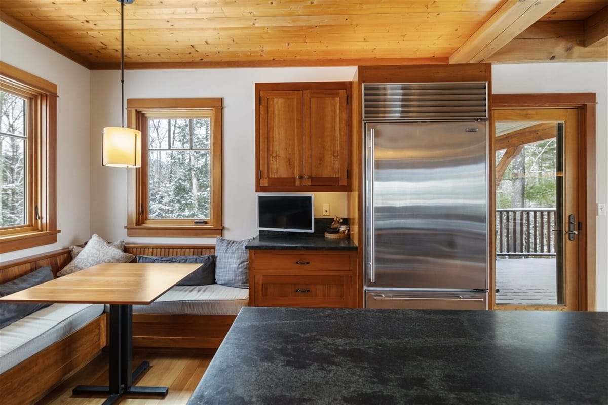 Cozy kitchen nook with fridge.