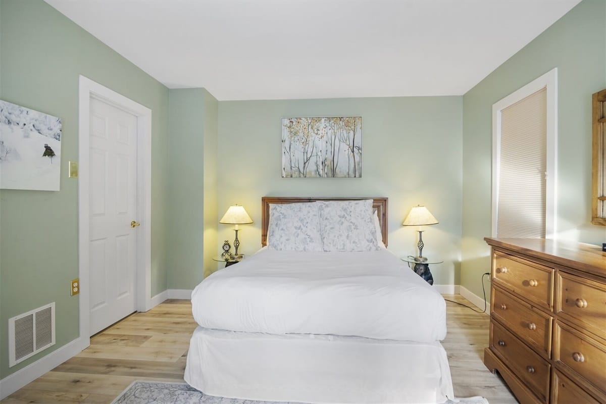 Cozy bedroom with green walls.