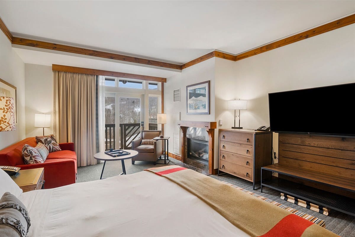 Cozy hotel room with fireplace.