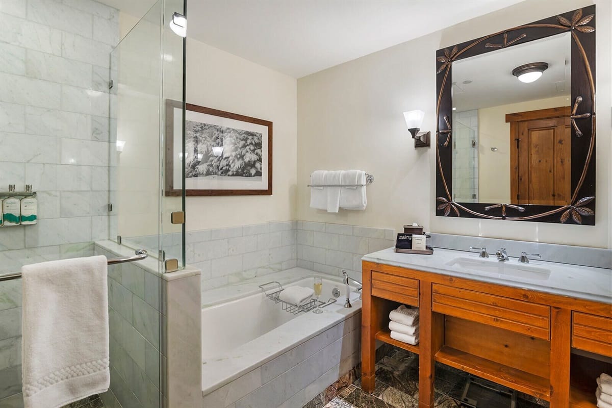 Modern bathroom with bathtub and vanity.