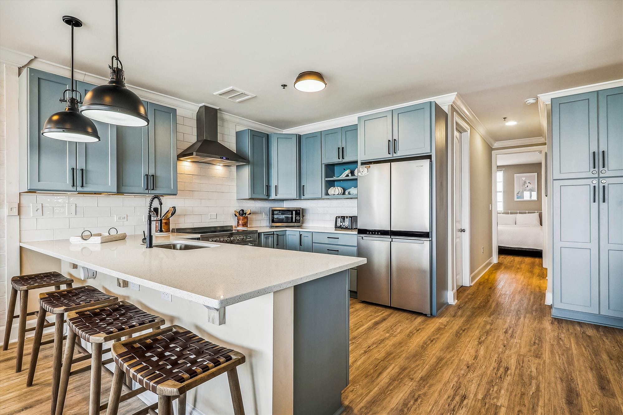 Modern kitchen with blue cabinets.