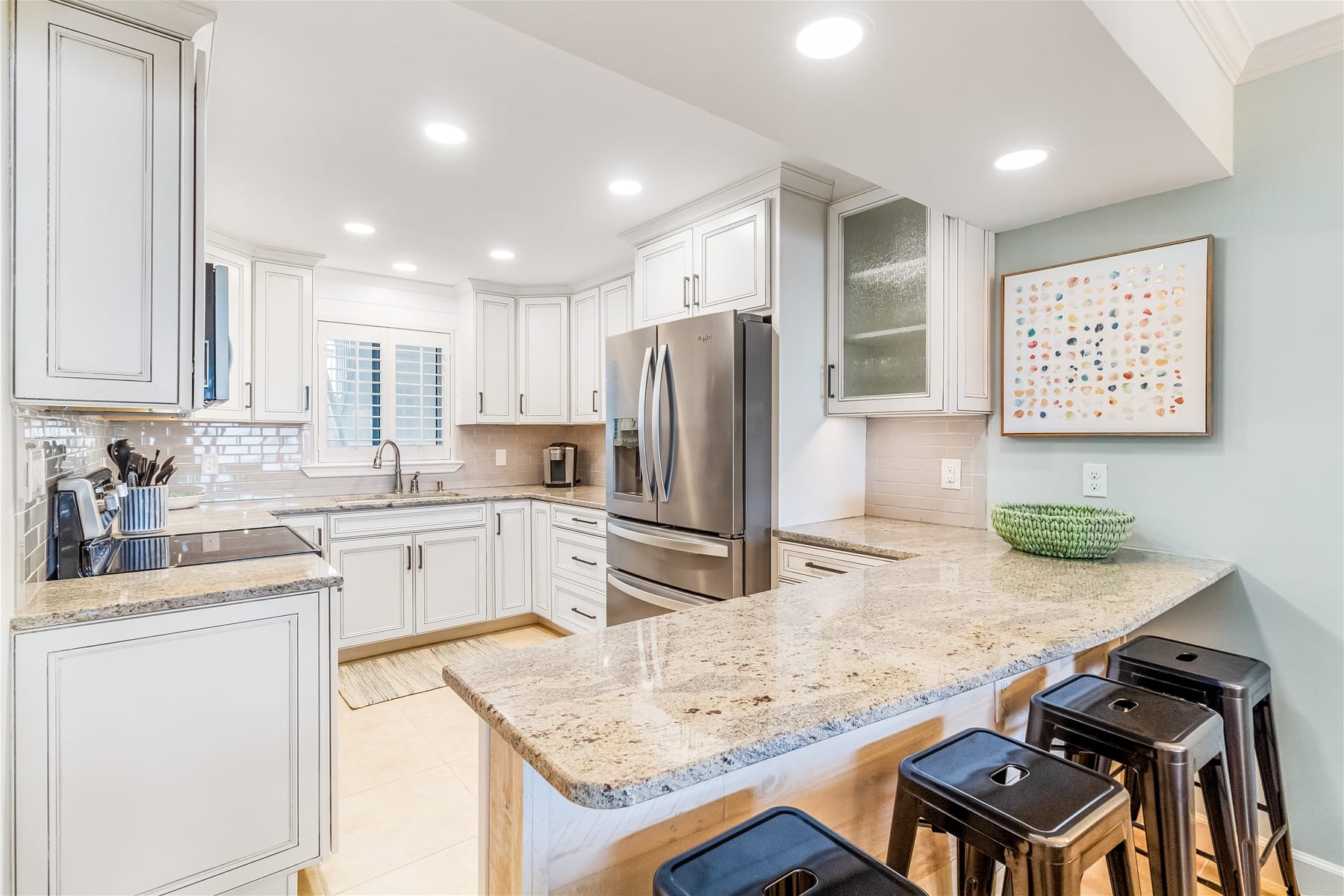 Modern kitchen with granite countertops.