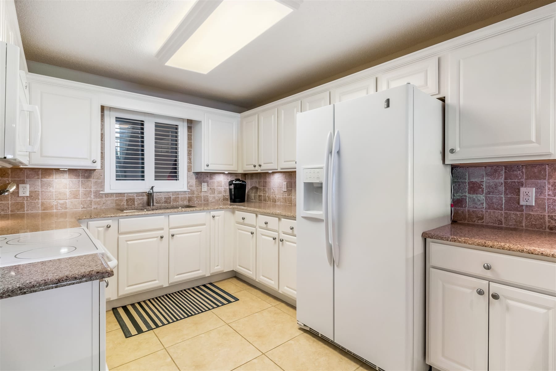 Modern kitchen with white cabinets.