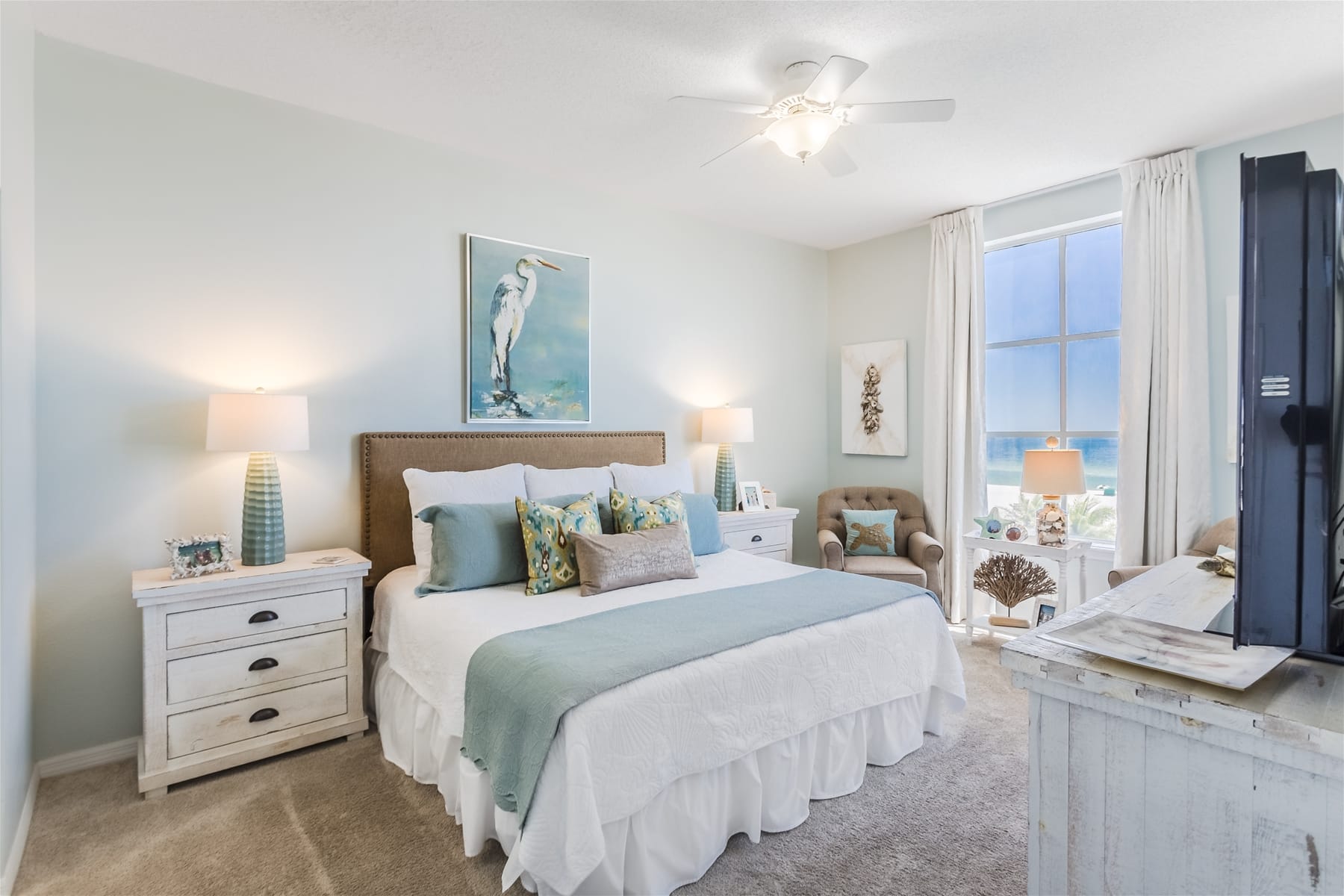 Bright bedroom with coastal decor.