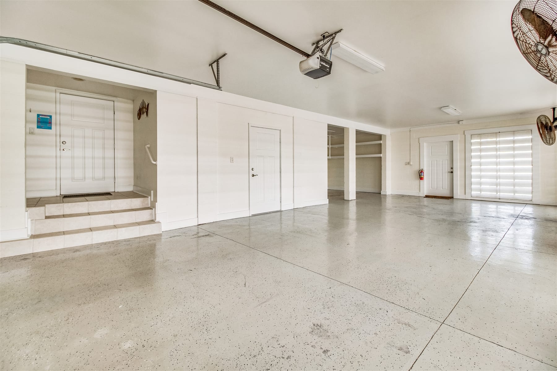 Empty garage with white walls.