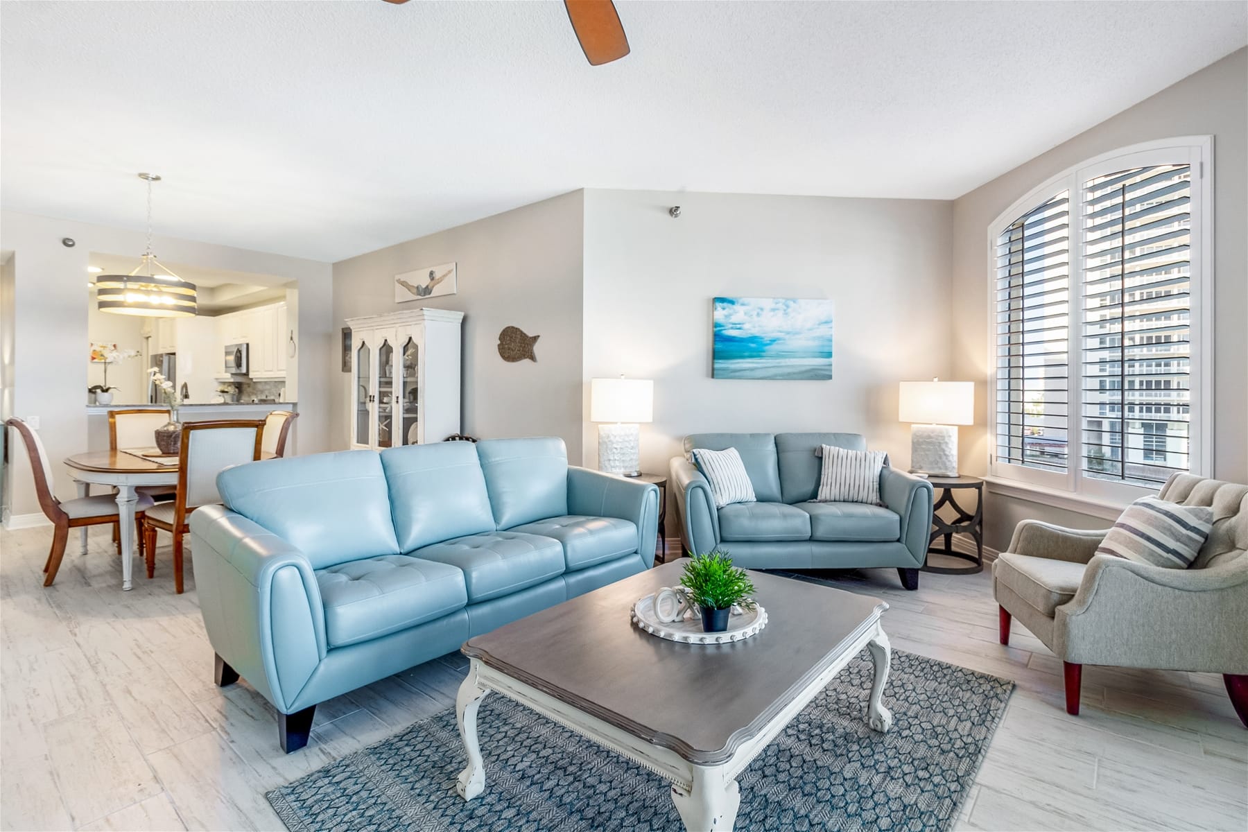 Coastal-themed living and dining area.