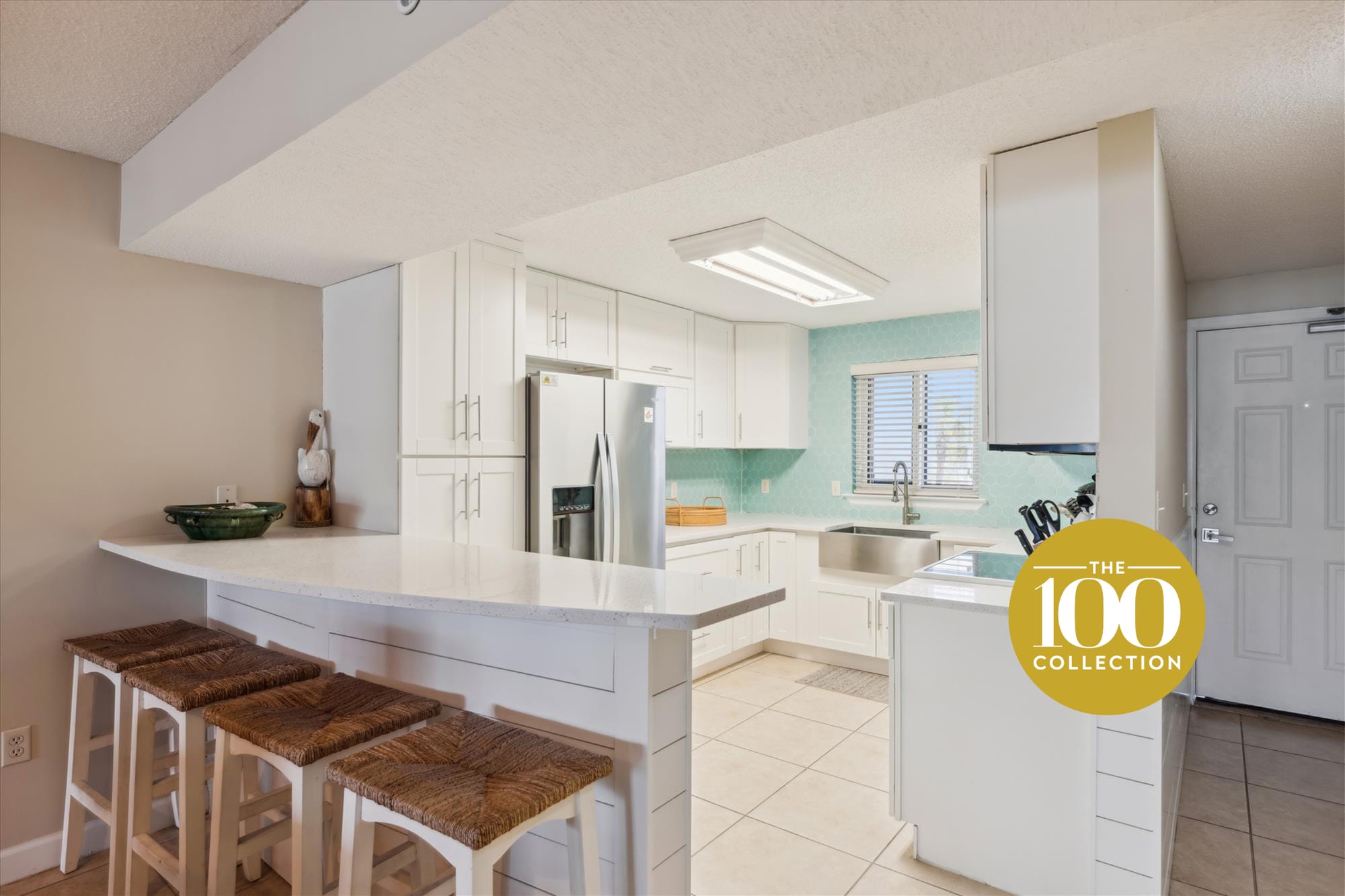 Modern kitchen with bar stools.