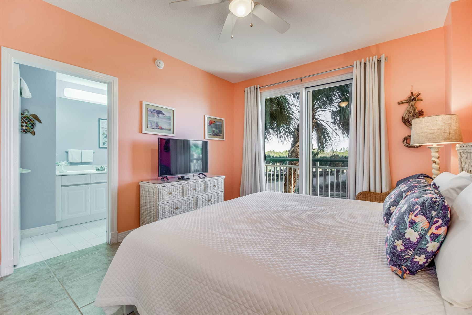 Bedroom with orange walls, balcony view.