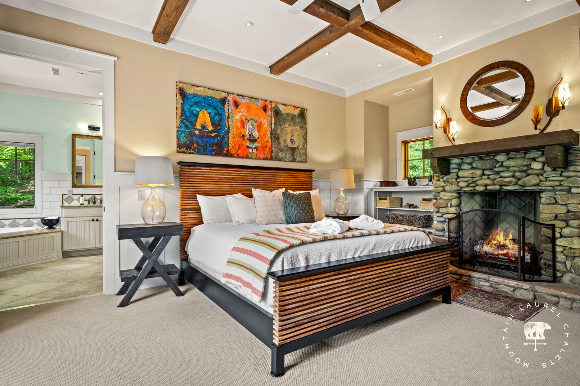 Cozy bedroom with stone fireplace.