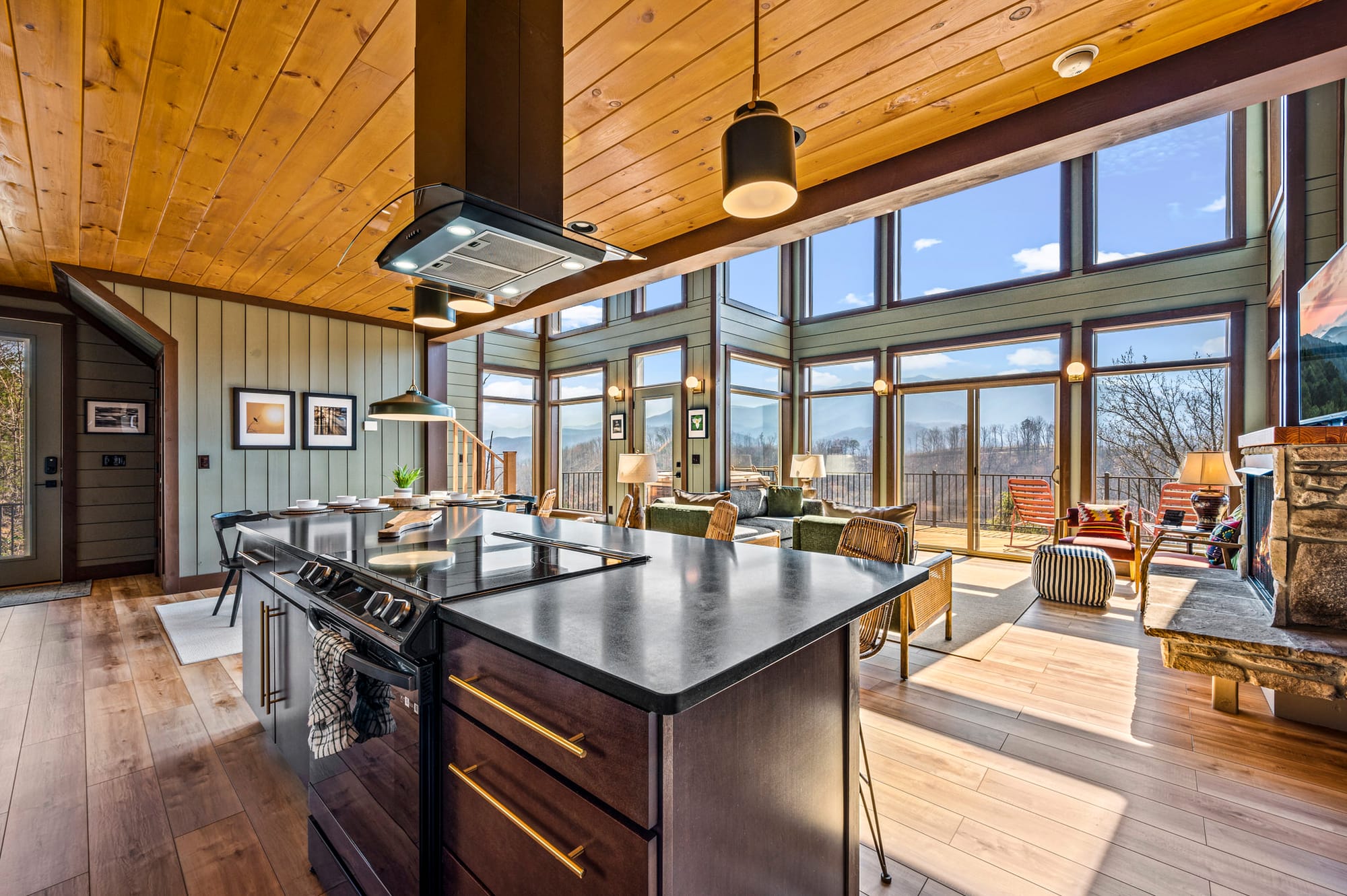 Modern kitchen, large windows, scenic view.