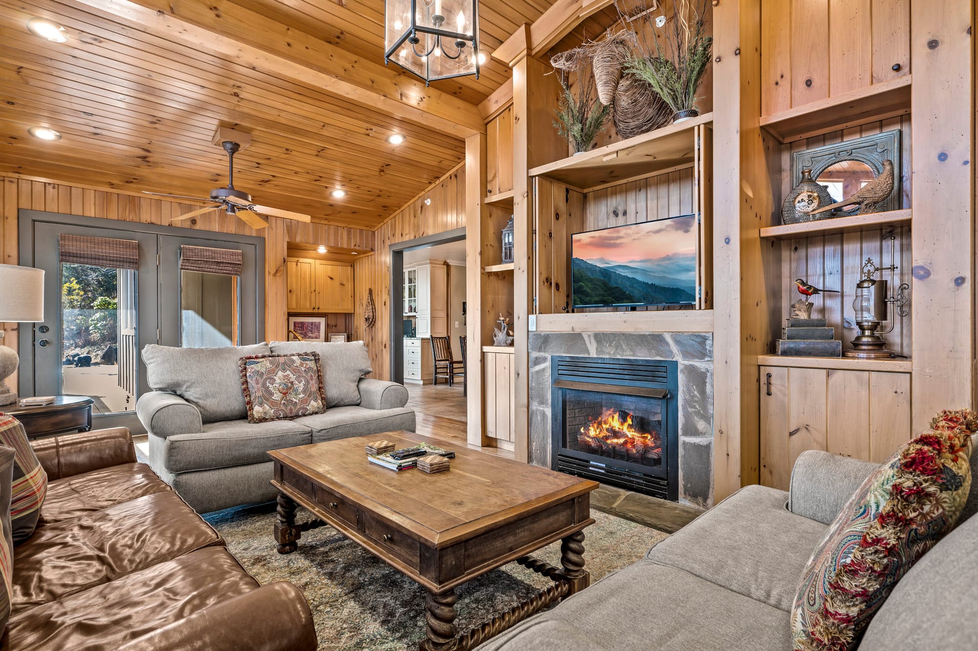 Cozy wooden living room with fireplace.