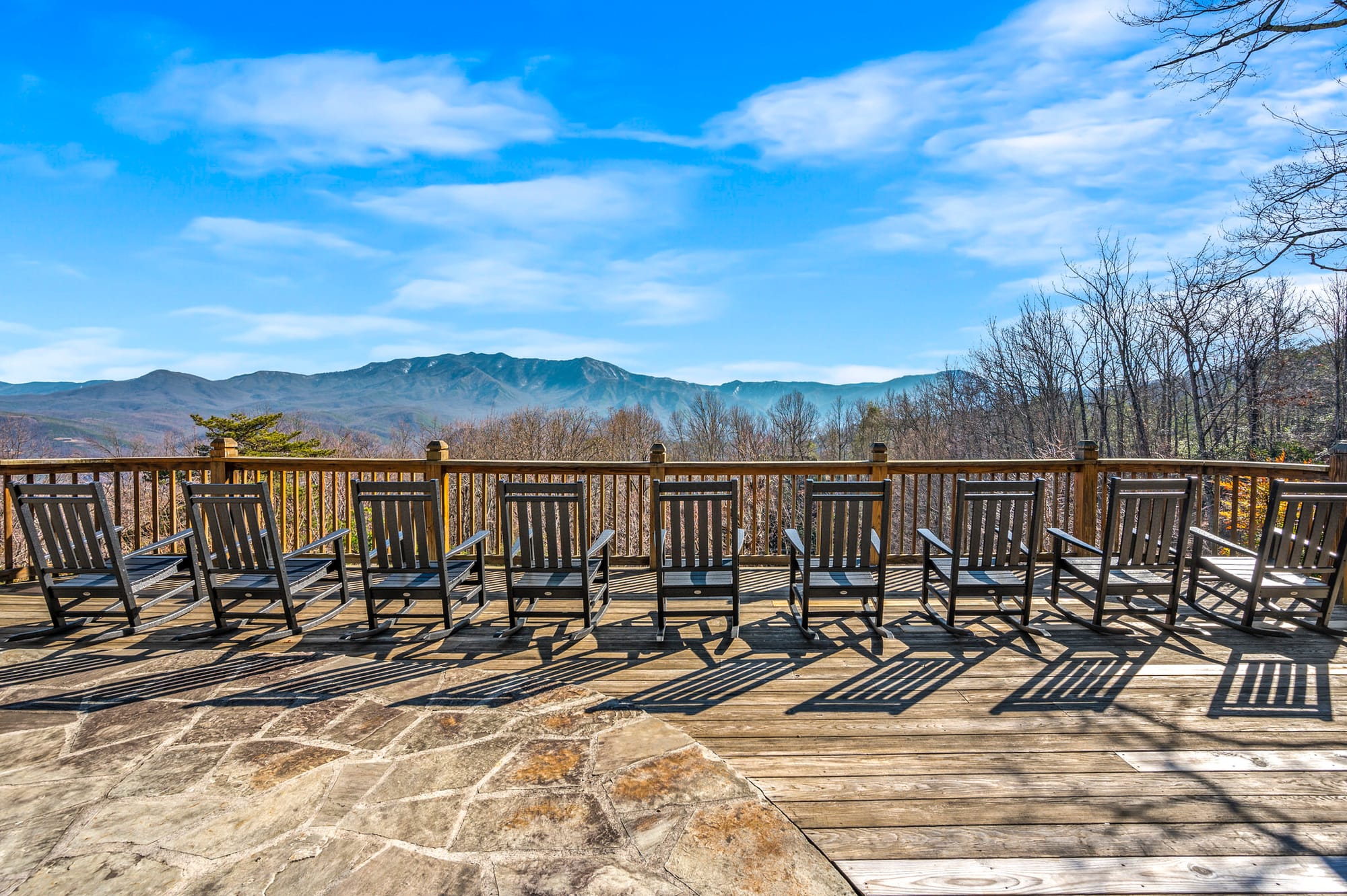 Deck with chairs, mountain view.