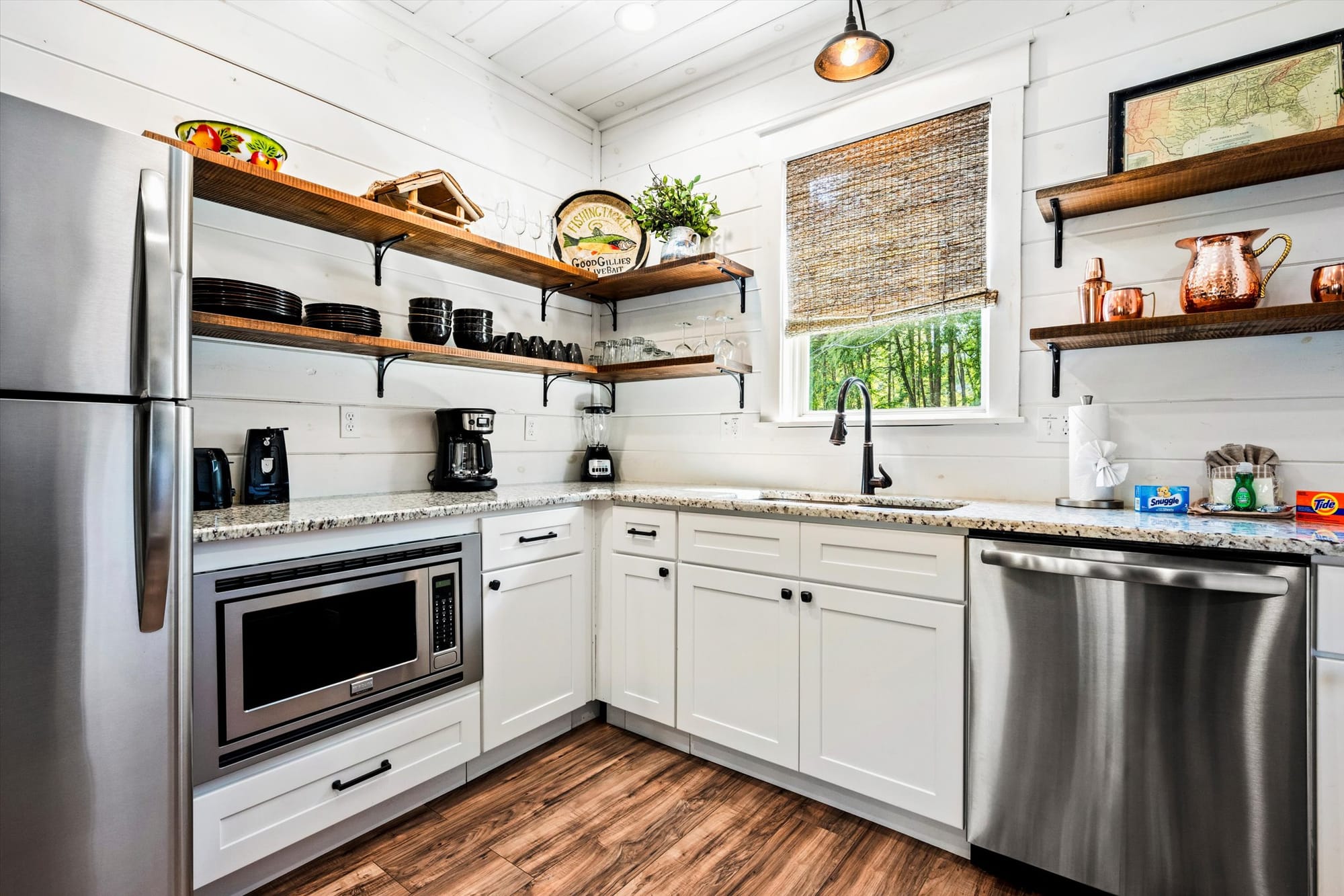 Modern kitchen with stainless appliances.