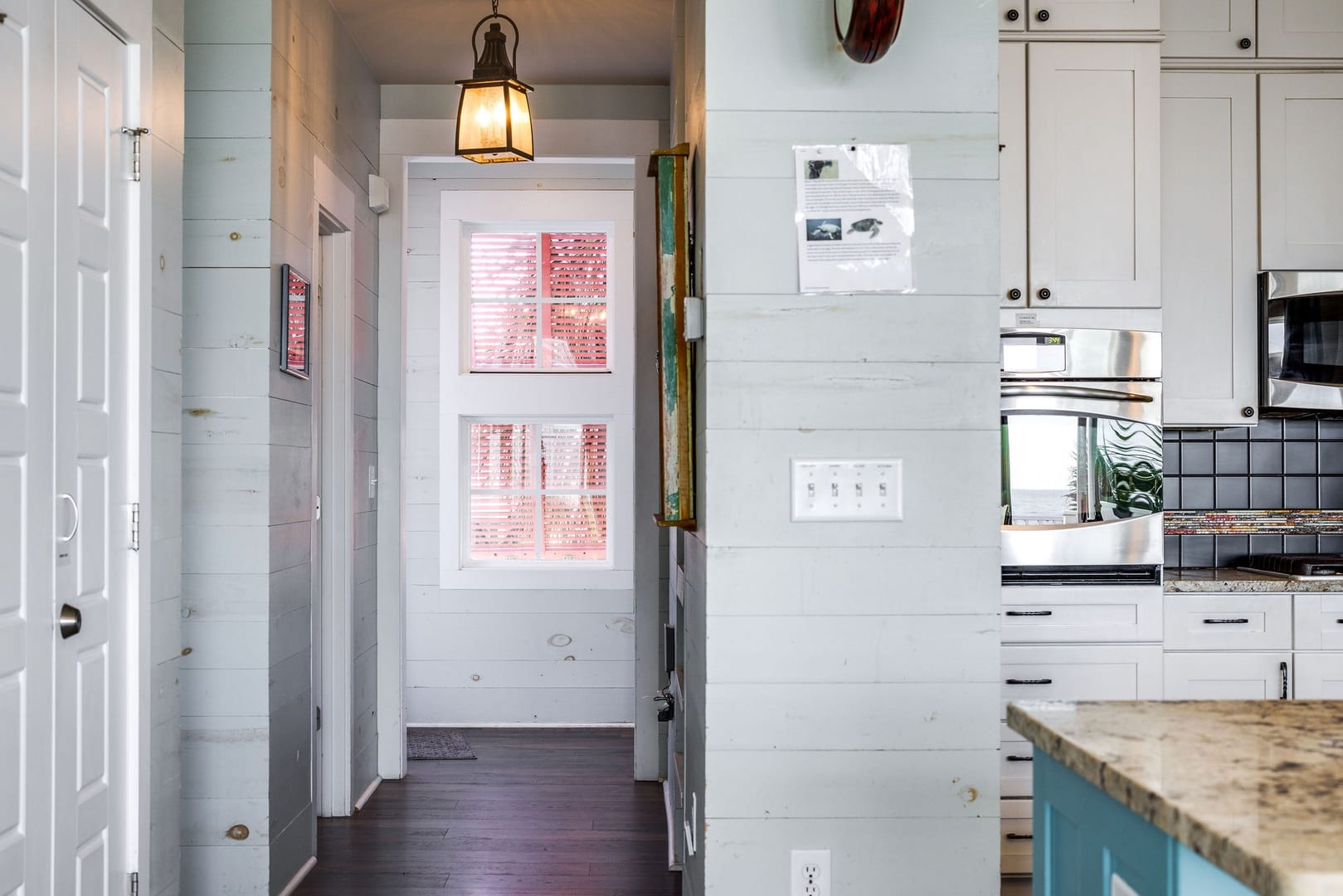 Cozy hallway with modern kitchen.