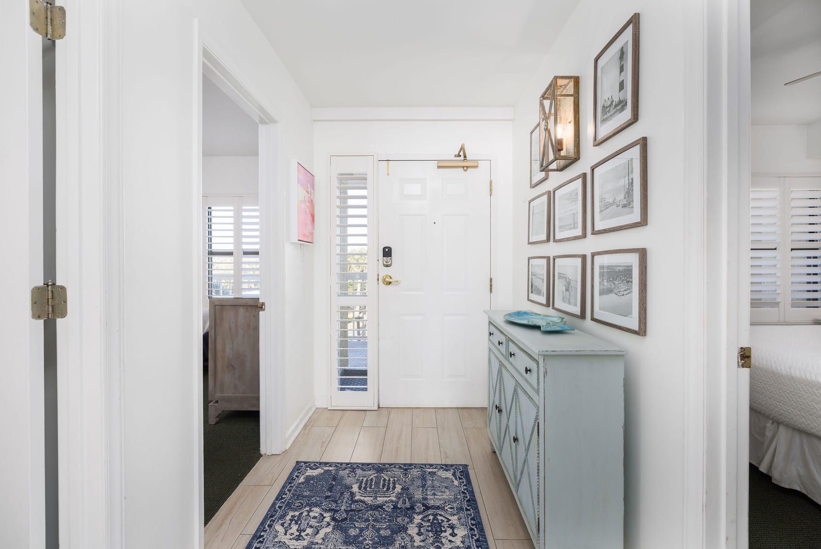 Bright hallway with wall art.