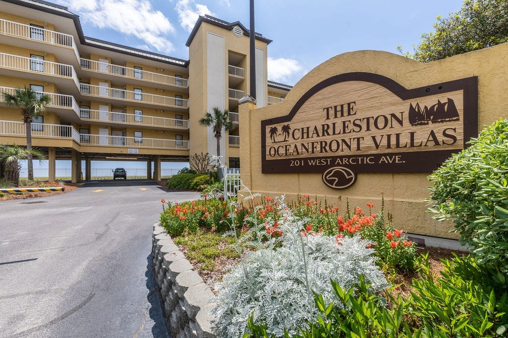 Oceanfront villas sign and building.