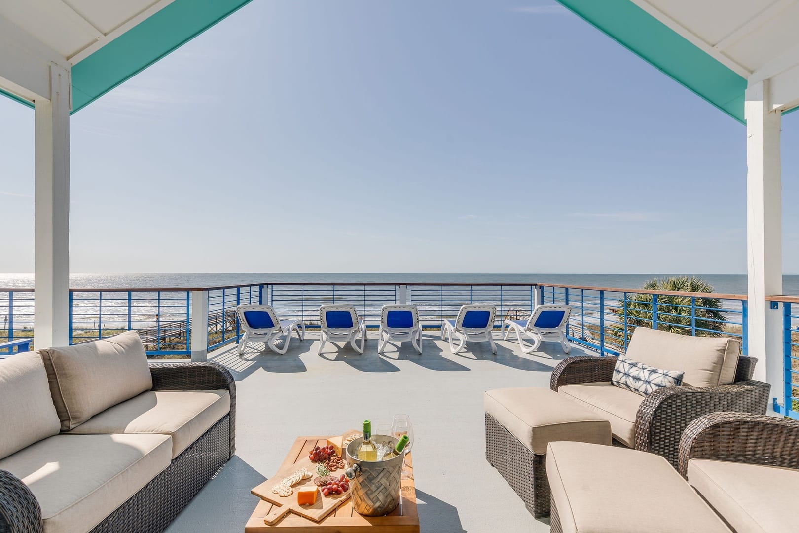 Oceanfront deck with lounge seating.