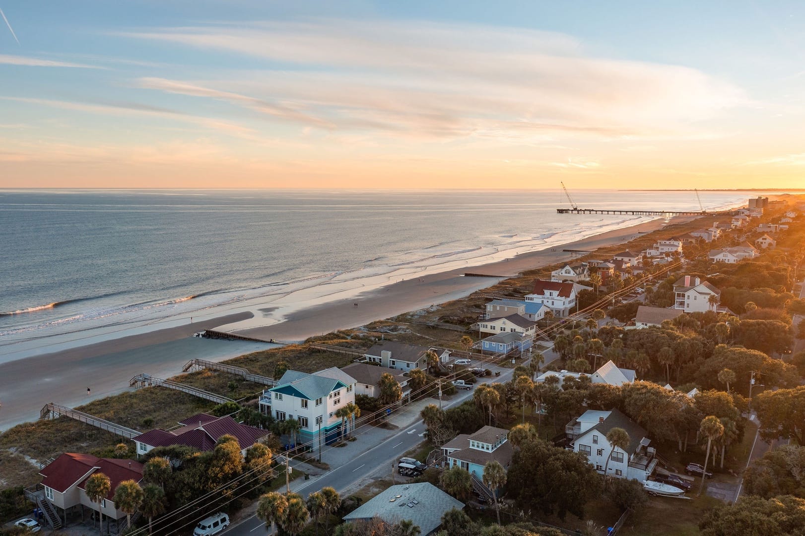 Coastal neighborhood at sunset, pier.