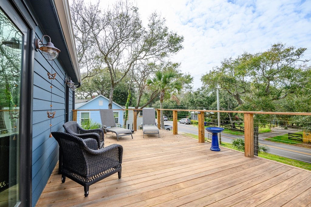 Wooden deck with outdoor furniture.