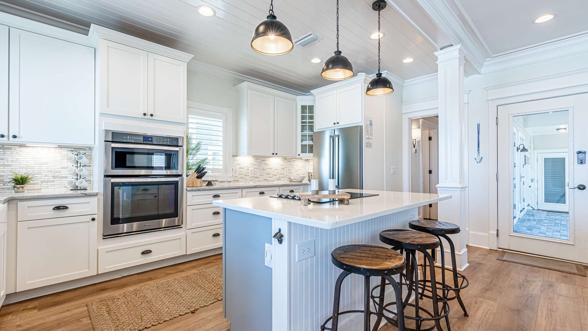 Modern kitchen with island, stools.