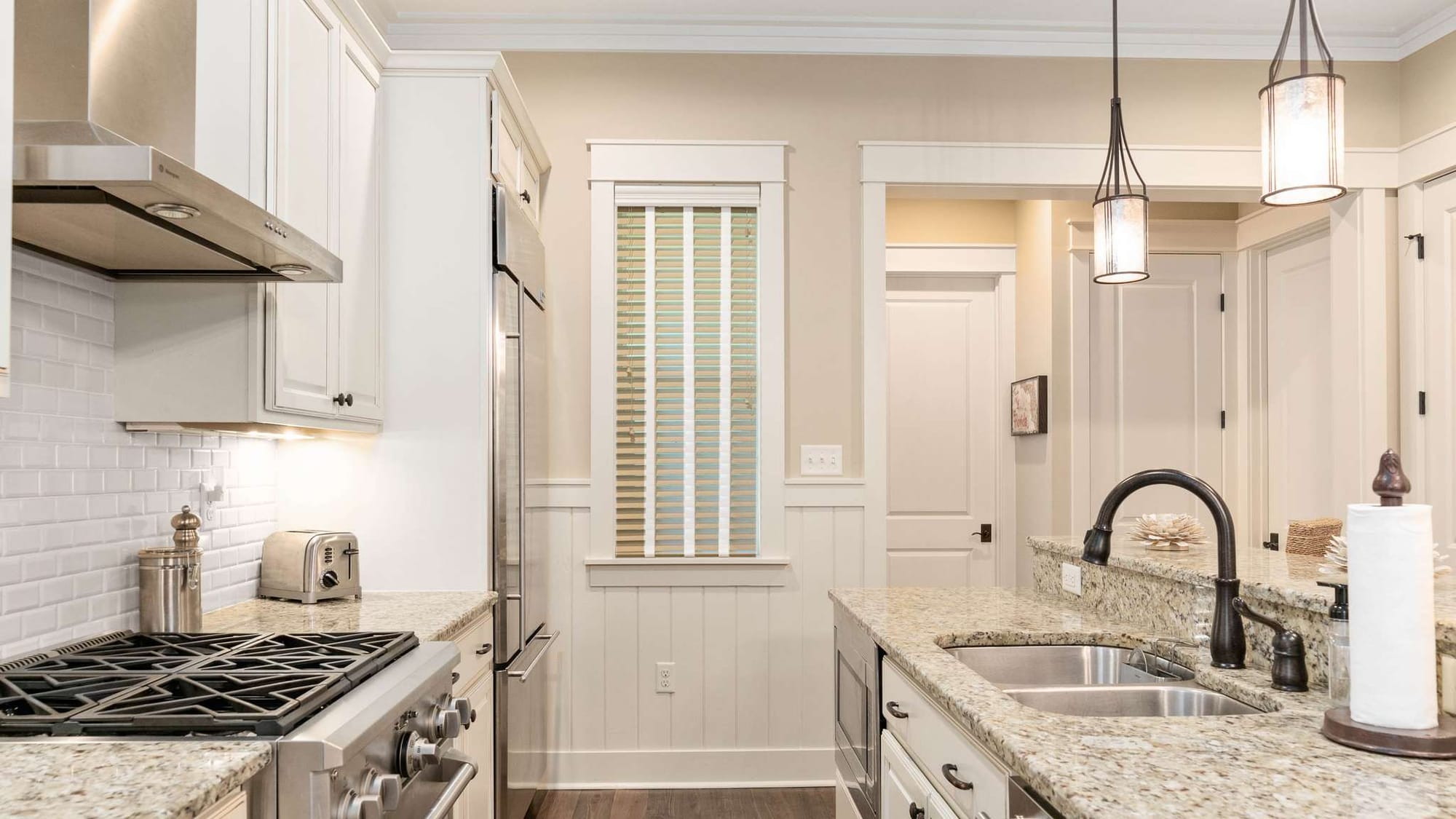 Modern kitchen with granite countertops.