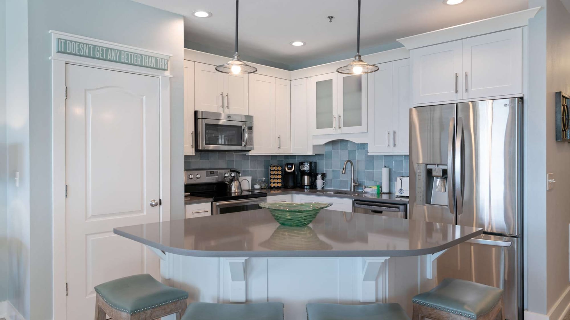 Modern kitchen with stainless steel appliances.